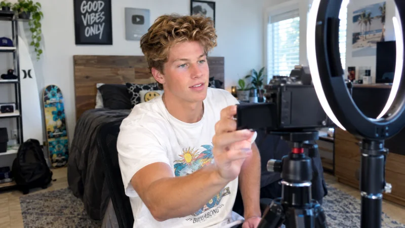 Ben Azelart setting up a camera to film a YouTube video