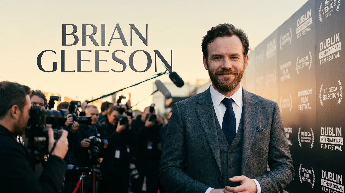 Brian Gleeson at a film festival photocall in a charcoal suit