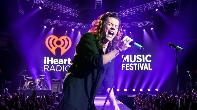 Harry Styles working in a recording studio on a solo album